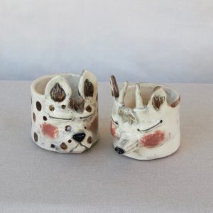 Little creatures with closed eyes. Made by Jo Ceramics