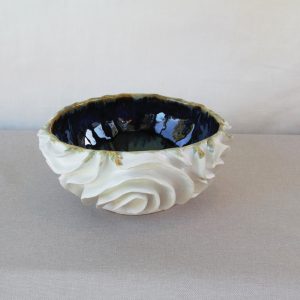 Decor bowl with white exterior and blue interior. Made by Jo Ceramics