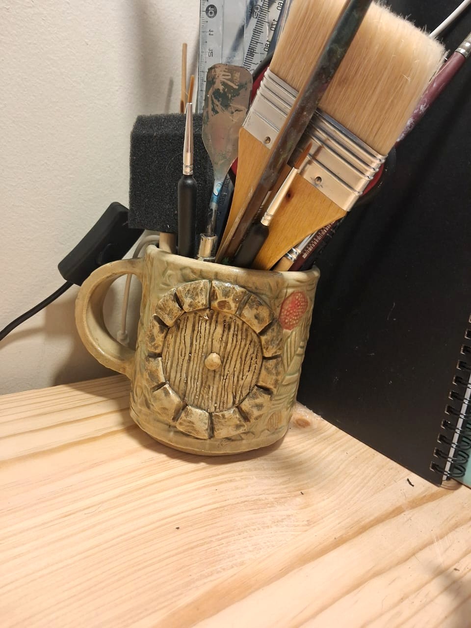 Tankard cup with Lord of the Rings / Hobbit door and floral design by Amy - pottery class student