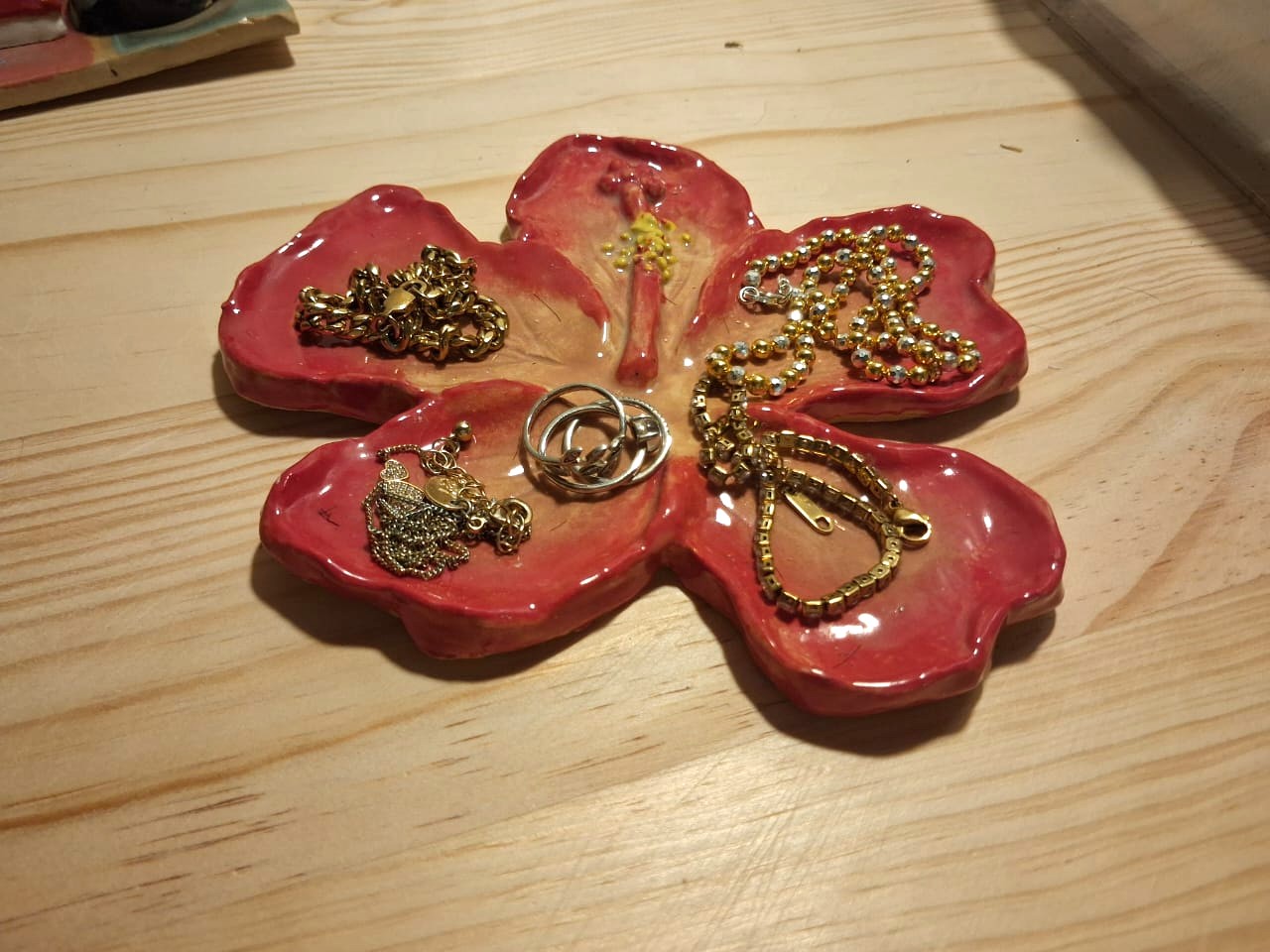 Hibiscus trinket tray by Amy - pottery class student