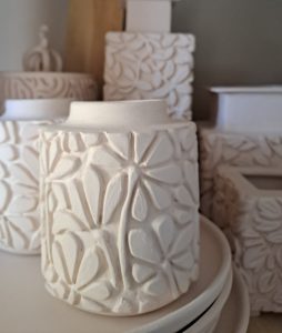 Handmade bisque fired clay pot pieces with floral design. Handmade by Jo Ceramics.